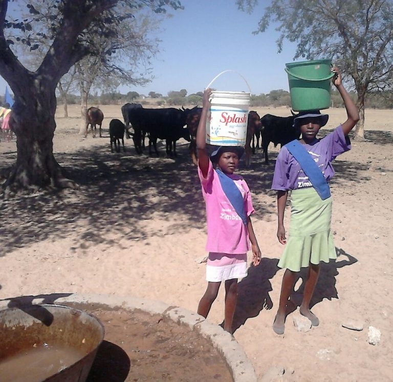 2 Girls Hauling Water