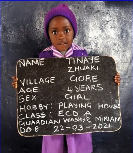 Girl holding placard