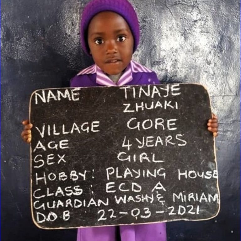 Girl holding placard