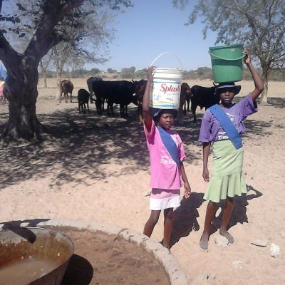 2 Girls Hauling Water